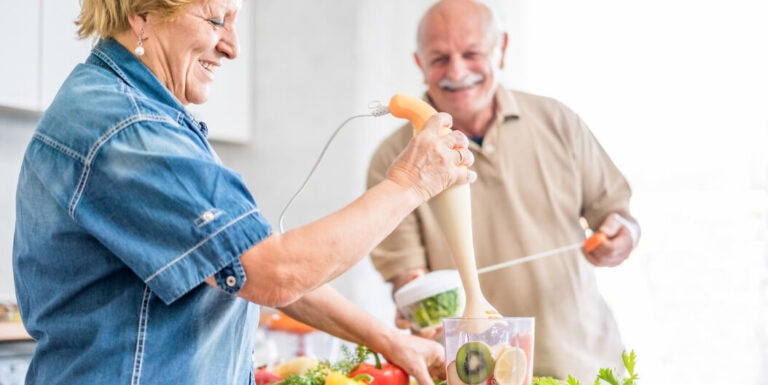 Elderly Couple Preparing Smoothies Together in Memory Care