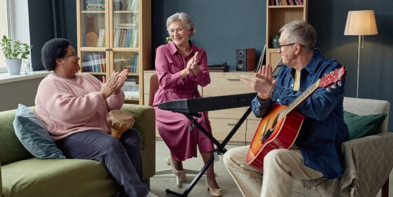 Elderly Residents Playing Music Together at Memory Care Facility