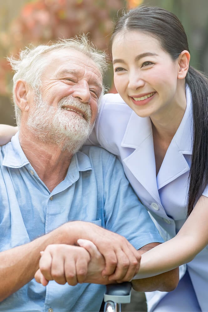 Nurse Comforting Elderly Woman at Nursing Home Colleyville