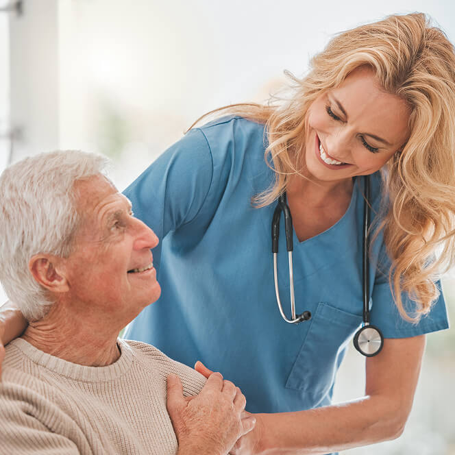 Caregiver Comforting Resident at Memory Care Facility